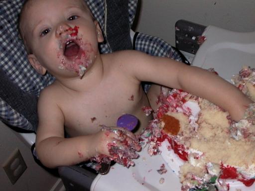 Logan devouring some cake